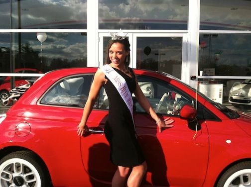 Whittany Evans strikes a pose in front of the Italian minicar Fiat 500 at Jim Benson’s Fiat Studio on Wade Hampton Blvd.