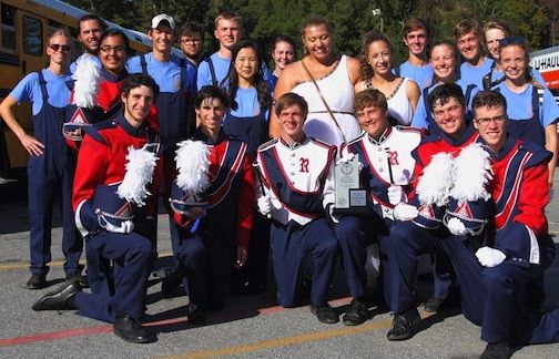 Representatives from the band with their winning trophy and the acknowledgement Riverside will be performing in the state band championships for the first time.
 
