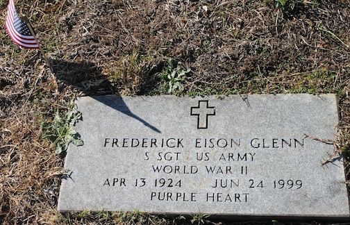 A flag marks the gravesite of S. Sgt. Frederick Eison Glenn, a WW II Purple Heart recipient
 