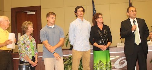 Jay Arrowood's family attended City Council's Tuesday meeting to see the 30-year volunteer fireman honored for his service. Left to right: Bruce and Pat (father and mother), AJ and Jake (sons) and Lisa (wife).