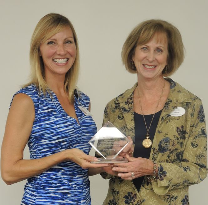 Diane Jarecky, left, receives award from Leslie Trant of CCD.
 