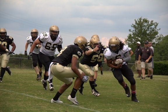 Greer's Emmanuel Kelly (6) had his way with his teammates during Monday's spring game at Dooley Field. Kelly scored 4 rushing touchdowns, passed for a 70-yard TD and scored on an interception return.