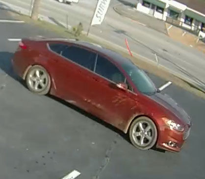 A possible suspect vehicle was captured on security cameras. The vehicle is maroon in color and was seen at the side of the business around the time of the robbery.
 