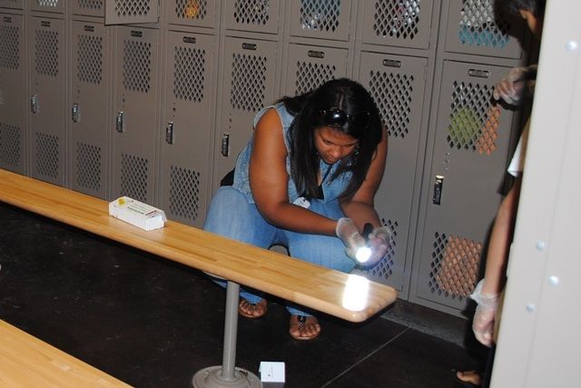 A flashlight is used to locate fingerprints and other crime scene clues.