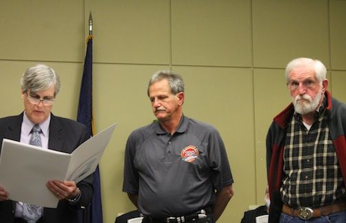 Danny, center, and Gerald Gambrell are read a proclamation by Mayor Rick Danner commending the Gambrells (David is missing from the picture) for their service as volunteer firefighters with the Greer Fire Department.
 