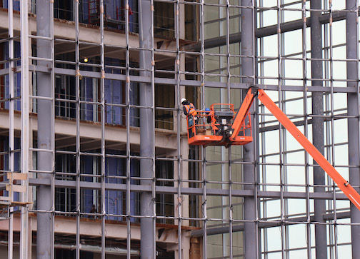 A construction worker prepares to hang glass Thursday on the outside of the Gibbs Cancer Center & Research Institute at Pelham expansion. Spartanburg Regional Healthcare System began expanding the cancer center, a division of Spartanburg Medical Center, in 2018. The 190,000-square-foot facility is scheduled to be complete in spring 2020. The cancer center is located next to Pelham Medical Center at 250 Westmoreland Road in Greer.
 
 