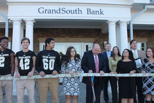 The ceremonial ribbon cutting included members of the Greer High School football team representing its booster club and Greer Community Ministries. Each received a $500 donation from GrandSouth Bank.
 
 