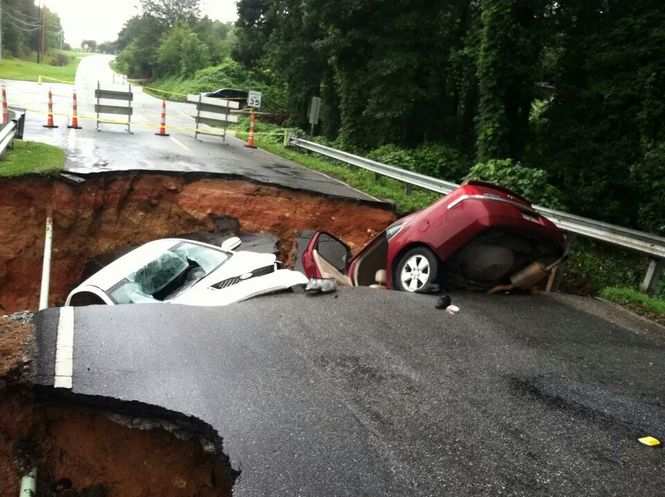 Two vehicles are in a collapsed road minutes after the drivers left a wedding reception.