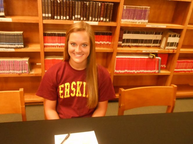 Jessica Gay is all smiles after signing a grant-in-aid with Erskine College.