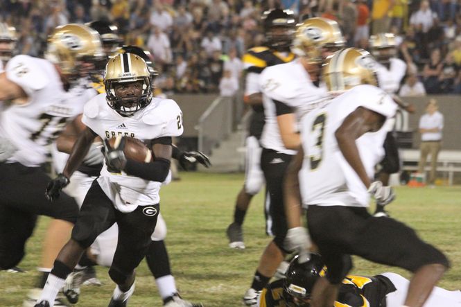 Quez Nesbitt, Greer's sensational junior running back, is the focus of defenses. Alex Waters, far left, and D'Anta Fleming (3) are clearing the path for Nesbitt on this play.
