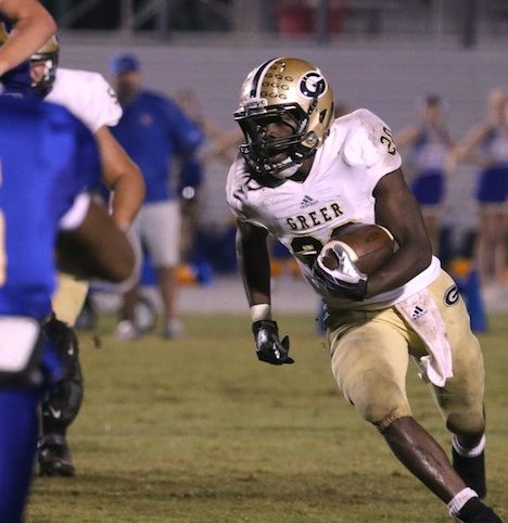 Quez Nesbitt leans to scoot past a Travelers Rest defender Friday night. He rushed for 290 yards and four touchdowns.