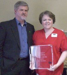 Cindy Anthony, and her husband, Mark, pose for a picture during the ceremony honoring the caregiver for outstanding service in 2012.