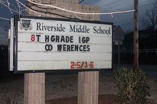 This Riverside Middle School sign will be replaced with a new digital sign displaying amber colored text. LEDs will replace the solar-powered lights that now illuminates the sign at night.