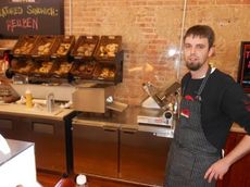 Jacob Danner, manager of the Lunchbox deli at Acme General Store, has daily bagel and sandwich specials. The bagels are produced in the Bronx, N.Y.