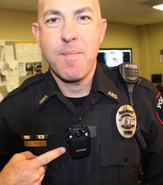Sgt. Jeff Smith displays a body camera that all patrol officers have been issued at the Greer Police Department.
 