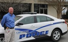The new design on the GSP police department's vehicles features a contemporary blue logo.
