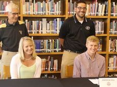 Greer High School's Andrew Hill signed a grant-in-aid to attend North Greenville University to run cross country. Hill's mother, Lynell, and cross country coach John Heberger, left, and track coach Jorge Santos attended the ceremony at the school.
 
 