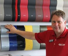John Montgomery is the Benson Studio Manager. He shows the range of colors available for the Fiat brands.