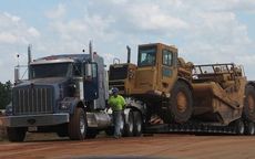 Heavy equipment no longer needed is removed from the port. 
