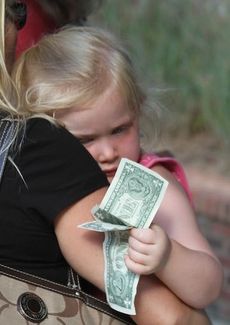 There's no way to know if this little girl's $2 went toward votes for the Greer Idol and Teen winners. 