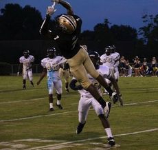 Tay Woods of Greer jumps to reack a pass that is overthrown to him.