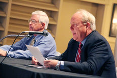 Perry Williams, right, takes his turn providing answers to questions during Monday's forum at Grace Hall. Williams is the incumbent commissioner of the Greer CPW.