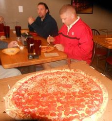 Now that's a big pie. Merrell's Pizza hosted police and volunteers involved with the Cops for Tots project.