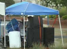This small tent does nothing to cover people during a fierce thunderstorm last Friday in Greer. The deluge of rain accompanied by lightning forced the second consecutive cancellation of Greer Idol and Tunes in the Park at the City Park amphitheater.