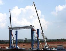 A second crane was moved in place to facilitate the assembly of the first of three rubber-tiered gantry cranes at the Inland Port.