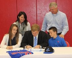 Andrew Friedholm signs with University of North Carolina-Asheville to play baseball. His parents, Carl and Kathy, and brother, Sean, and sister, Rachel attended the happy event.
 
 