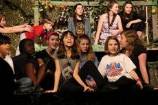 An ape ensemble, young apes and plant ensemble perform throughout the stage musical adapted from Disney's 