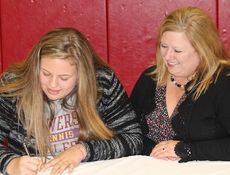 Caroline Bertling signs to play tennis at Converse College. Her mother, Cecelia, attended the ceremony.
 