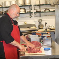 Chef Les Waugh cuts ribeyes and sirloins into beef tips to serve Thursday when Lake View Steak House reopens.
 
 