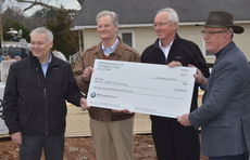 Presenting the $70,000 donation to Habitat are Johannes Trauth (BMW Vice President of Human Resources), Lee Close (Executive Director for Habitat for Humanity of Spartanburg), Manfred Erlacher (President and CEO, BMW Manufacturing Co., LLC), and Monroe Free (Executive Director of Habitat for Humanity for Greenville County).
 
 
 
 