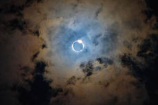 The most magical image photographers wait their lifetime during an eclipse is the diamond ring atop the eclipse. Look closer and notice the shape of the clouds may be interpreted as a heart.
 