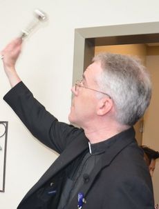 Father Jon Chalmers officially blessed the building and staff of the Bon Secours St. Francis Health System.