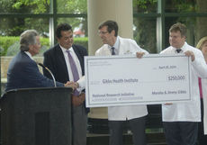 Left to right: Jimmy Gibbs presents Bruce Holstien (SRHS CEO), Dr. Timothy Yeatman and Dr. Mark Watson presents a $250,000 gift towards the Gibbs Health Institute (GHI), a national initiative that is said to revolutionize the way clinical cancer trials are done and how personalized medicine is delivered in the community setting.
 
 
 
 
XX