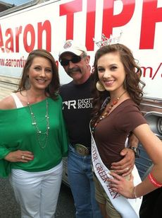 Gina and Sydney Sill posed with Aaron Tippin before his performance during Saturday's Family Fest. Sydney, Miss Greater Greer Teen, was at the Family Fest Friday and Saturday emceeing the Miss Princess contest with Miss Greer Lauren Cabaniss. The Miss South Carolina Pagean is less than two months away.
