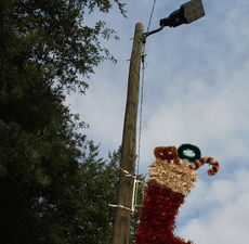 A Christmas stocking is hung under the LED lights at Pine Street and Wade Hampton Blvd., to see if the LED lighting is hindered by the decoration.
 