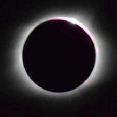 The prized diamond ring photo during an eclipse is at a point when the moon almost completely covers the body of the sun. This is what it looked like HereInGreer.
 
 
 
 