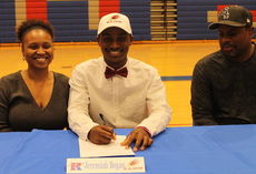 Jeremiah Bogan signed with Elon College to play football. Parents Antonina and Larry Geer attended the ceremony.
 
 