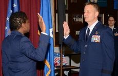 Brig. General Scott Kelly, a native of Greer, takes the oath as a general officer given to him by Brig. Gen. Allyson Solomon, the assistant adjutant general-air.
