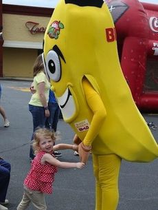 Cara Bishop found a willing dance partner in Buddy Banana, one of Walter’s produce mascots at Saturday’s Kids Fest.
 