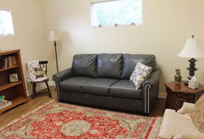 The living room is spacious with a sofa-bed part of the furnishings.
 