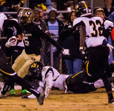 Troy Pride escapes a Union County player to score on a 3-yard touchdown pass play from Mario Cusano.
 