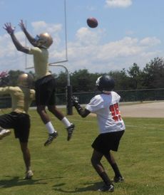 Greer defenders go high to tip a pass away from its target.