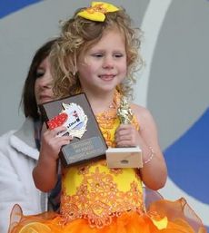 It's all smiles for a double winner at Saturday's pageant.
