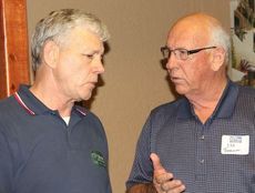 Joe Barnett, right, chats with Tom Ervin, independent candidate for governor, at a town hall meeting Tuesday.
 
 
