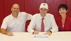 Will Strickland signs to play golf at Presbyterian College. His parents, Dave and Caron, attended the ceremony.
 
 
