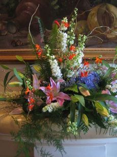 This flower arrangement by Susan McNamara showcases her expertise using twigs, moss and greenery in her creations.